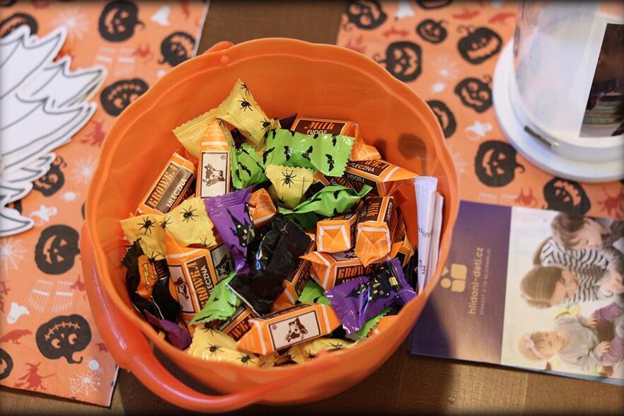 A bowl of individually wrapped sweets at a stop