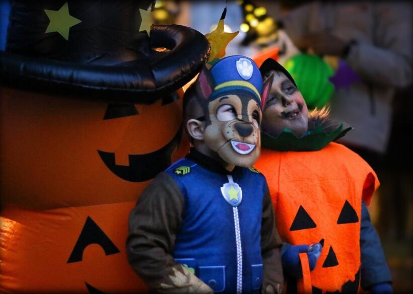 Inflatable pumpkins and children in costumes